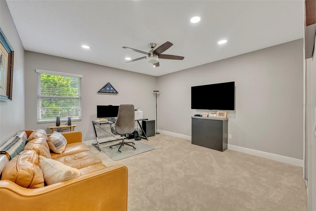 Guest bedroom currently used as an office with ultimate lighting