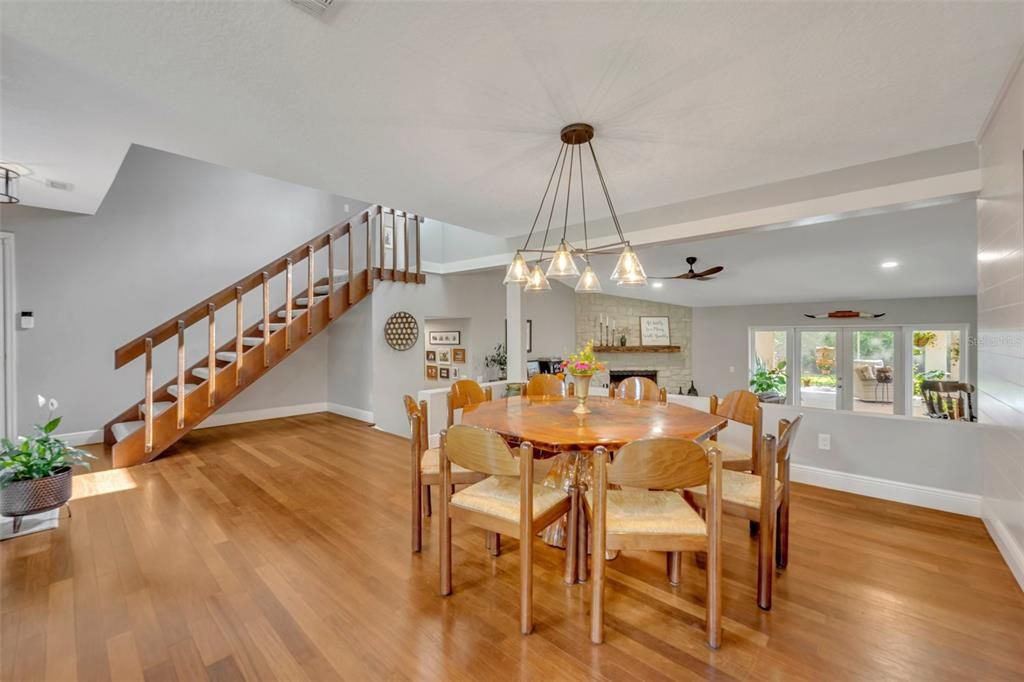 Different view from kitchen of large dining area looking towards the staircase to owners suite