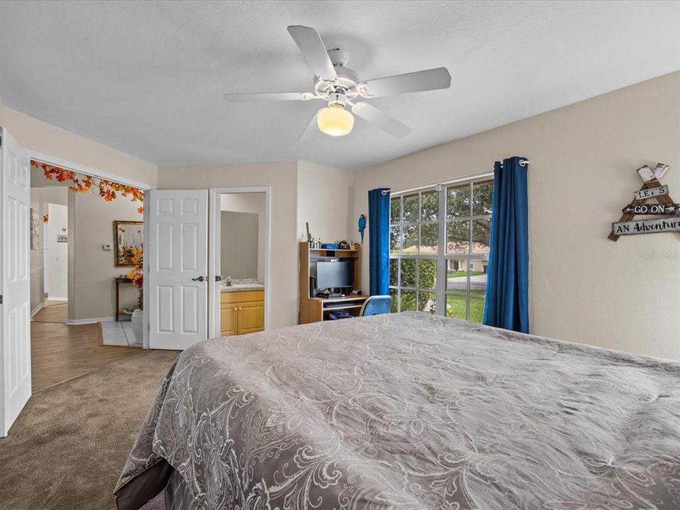 2nd bedroom view of double entry doors and half bath.