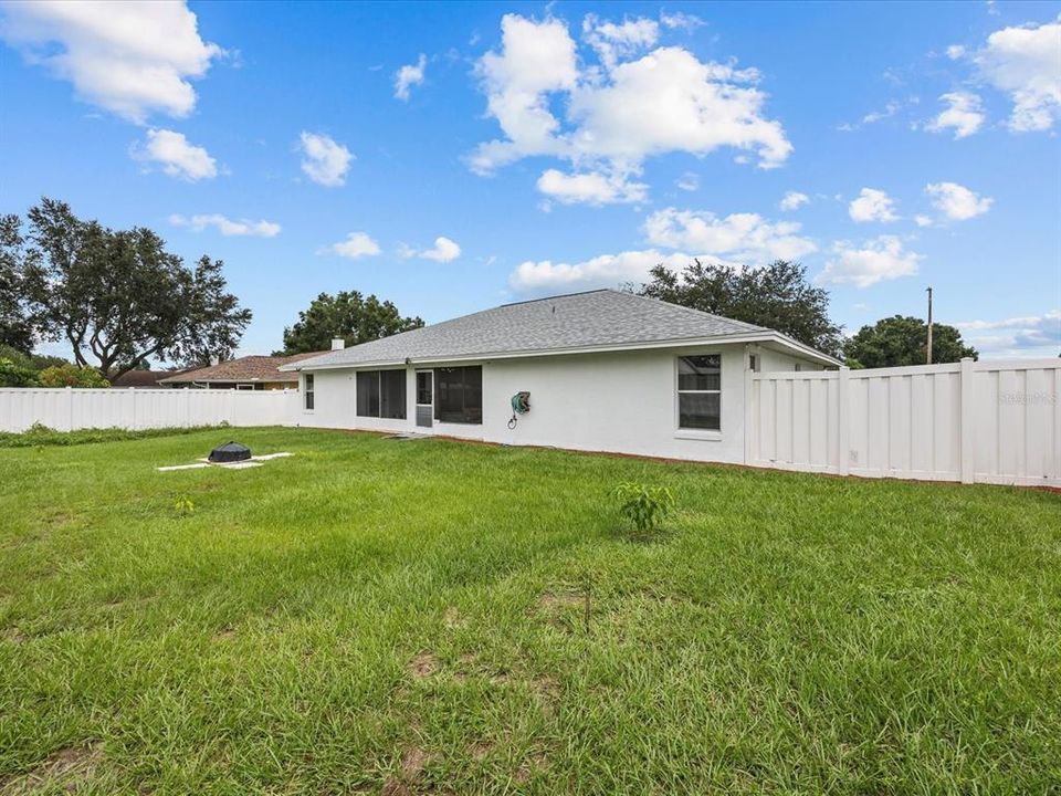 Large vinyl fenced in yard.  Small fire pit for those cool winter weather enjoyment.