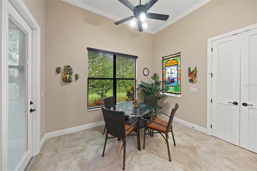 Kitchen eating area overlooking backyard