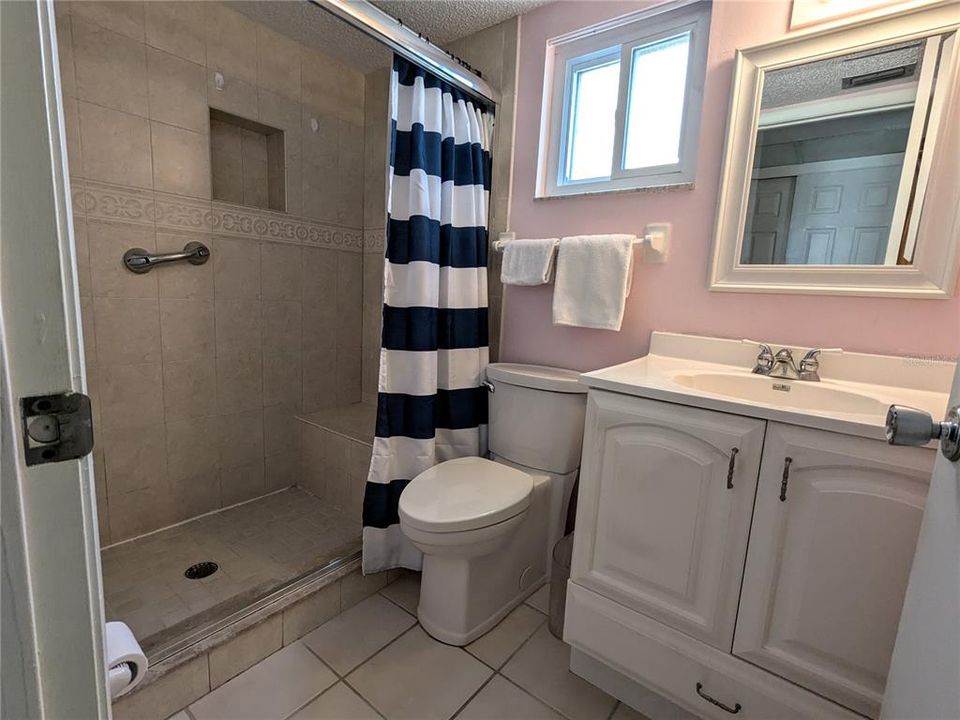 Ensuite bathroom - showing extra closet's doors in mirror