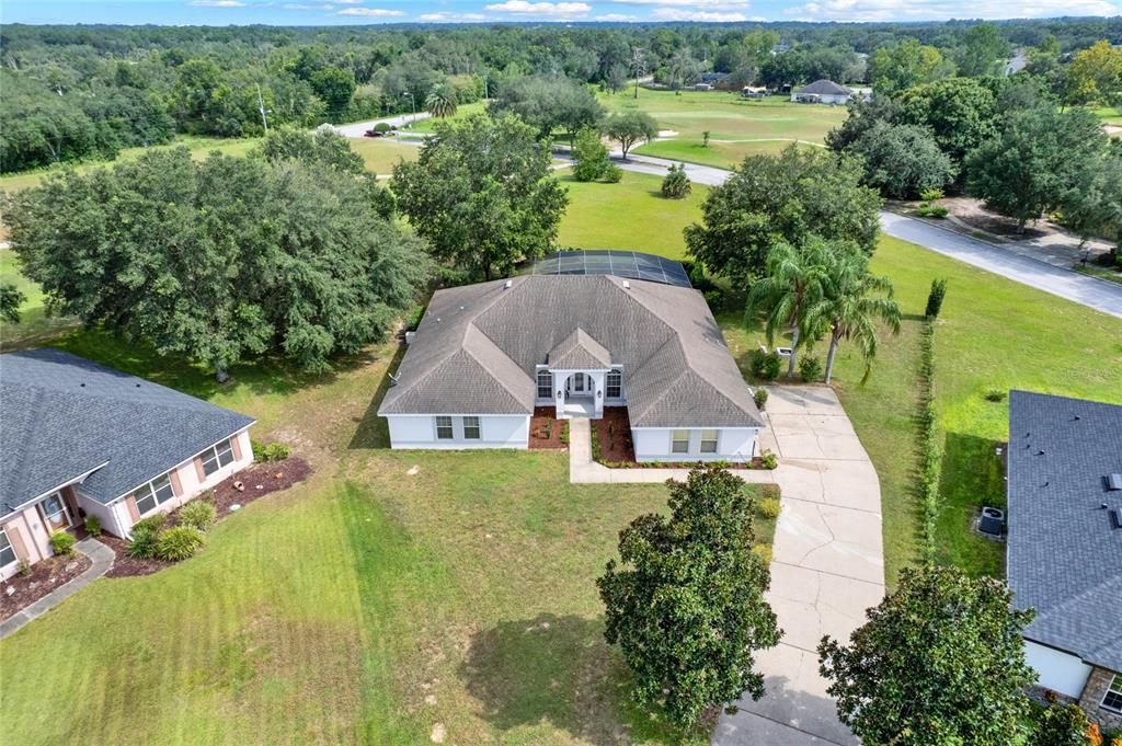 Aerial view of the front of the home and private driveway