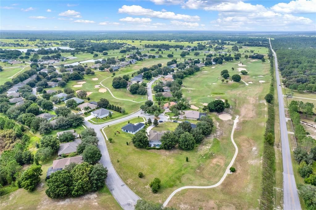 Aerial view of the property layout and golf course community