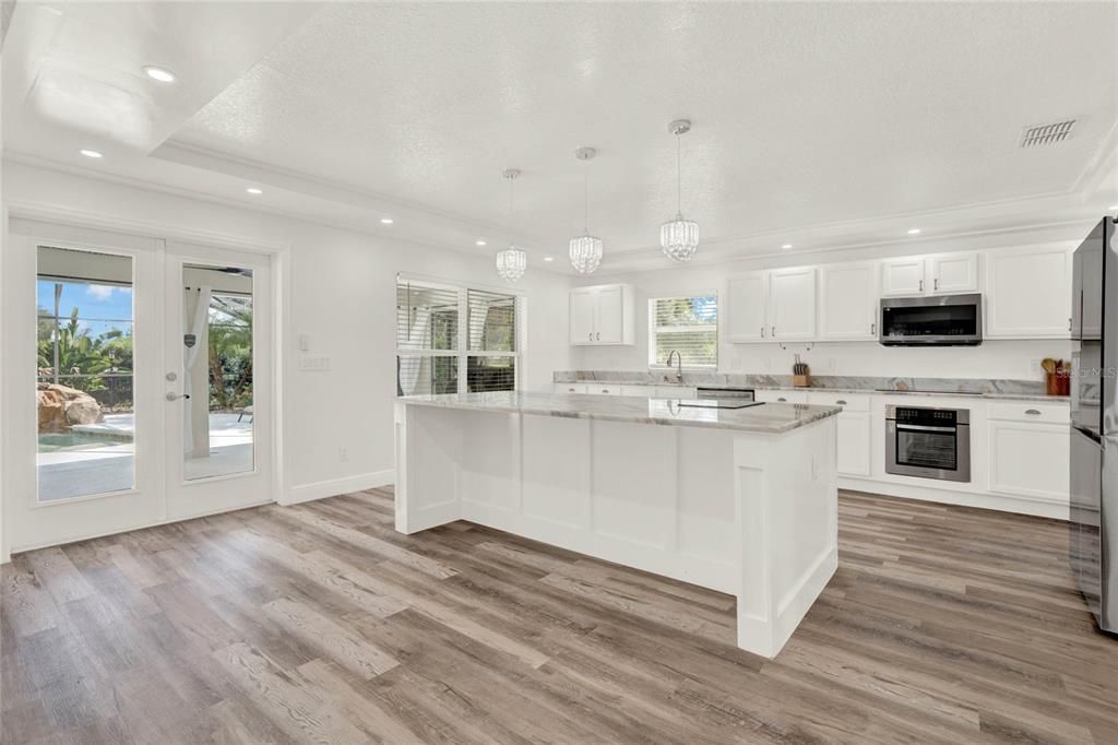 Kitchen has a pool view