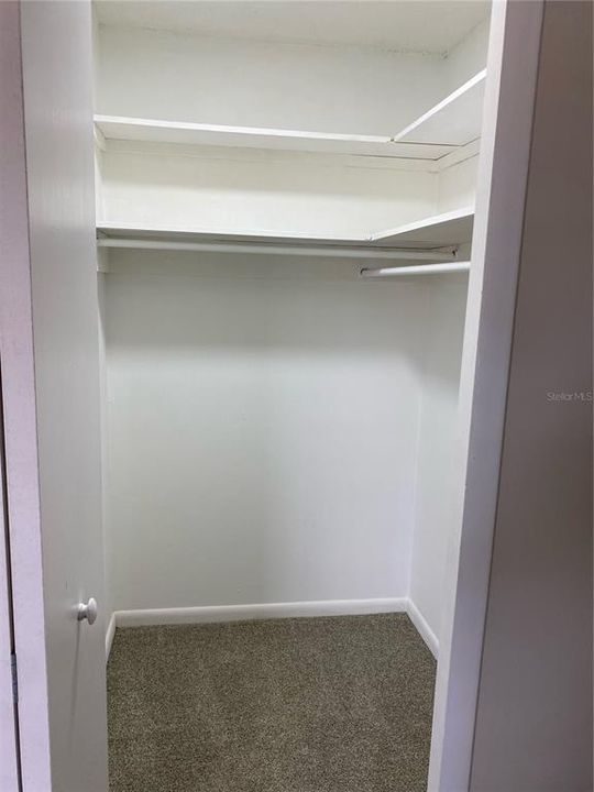 Primary walk-in closet.