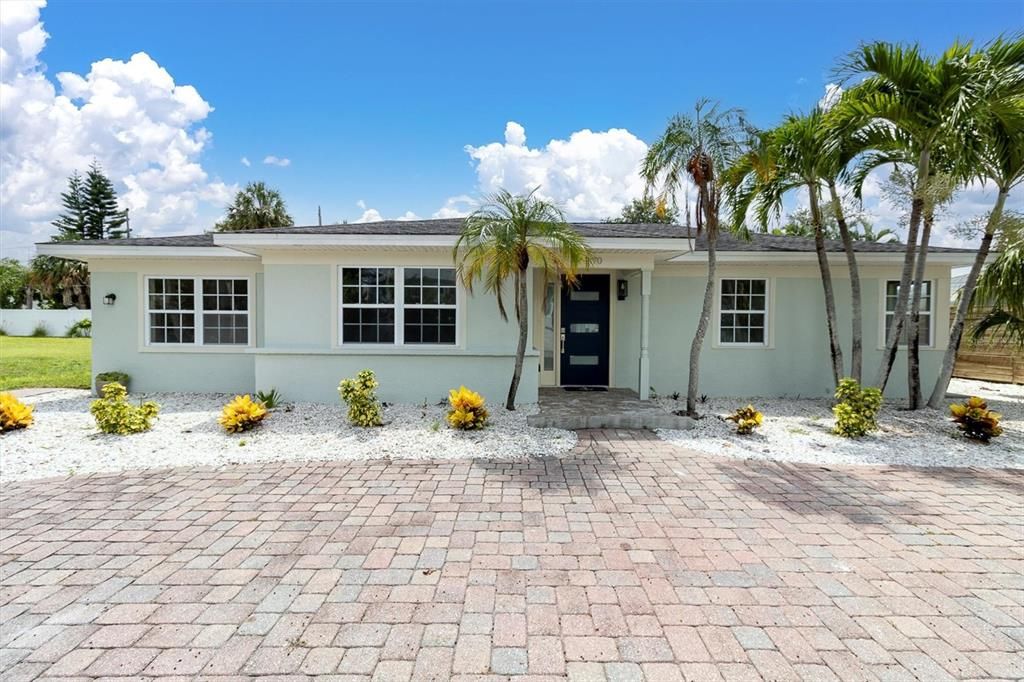 Front view with brick paver circular driveway