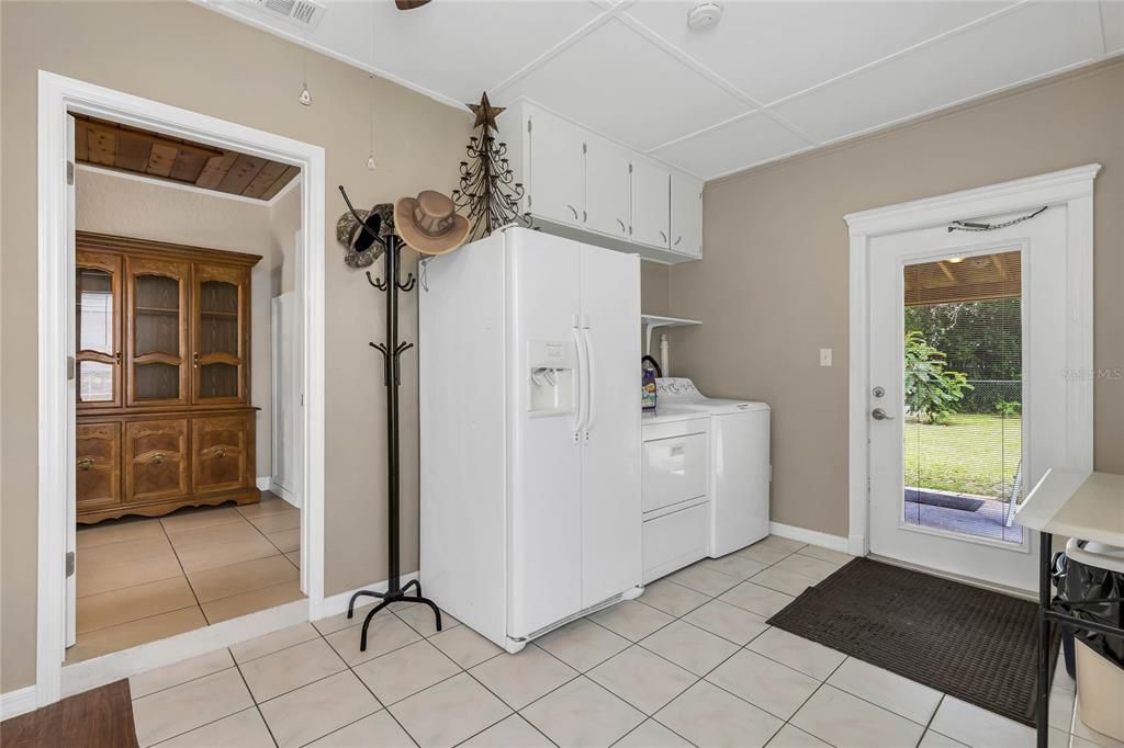 Laundry with door to rear yard.