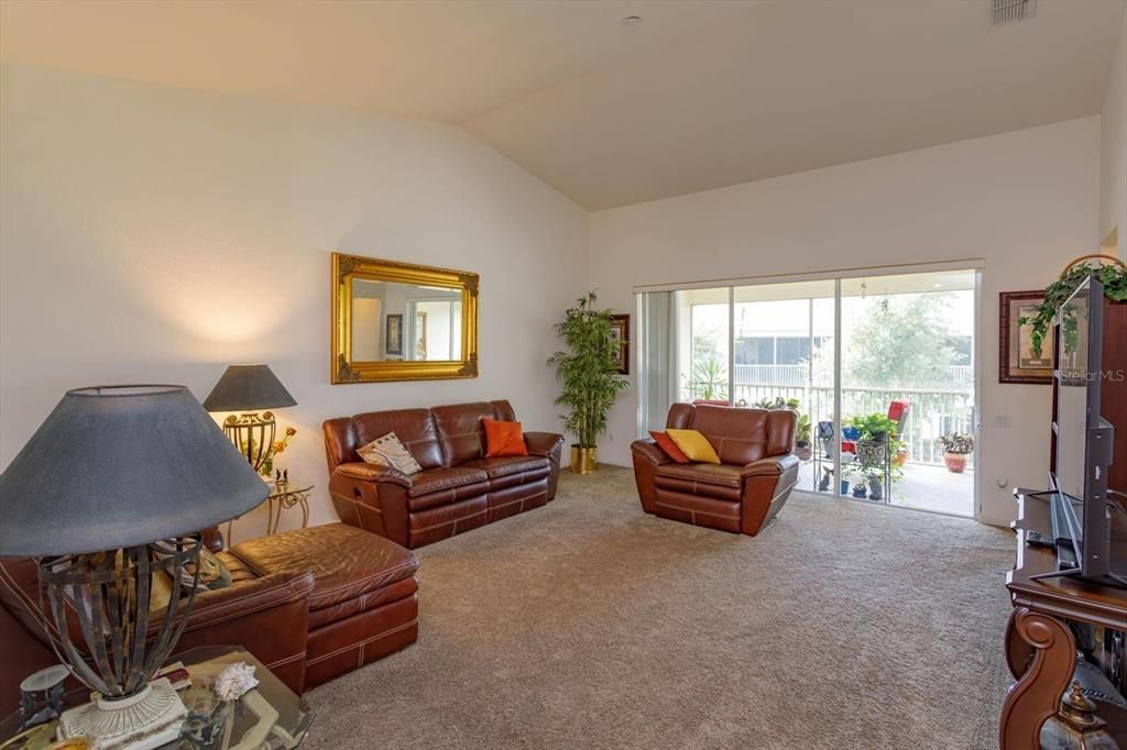 Big family room with triple sliding doors