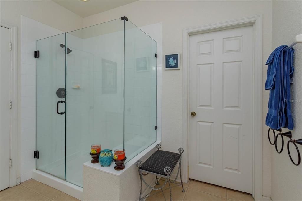 Seamless glass enclosure with bench plus 12x7 walk in closet