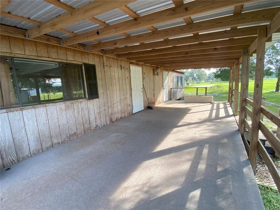 Large covered porch on second house