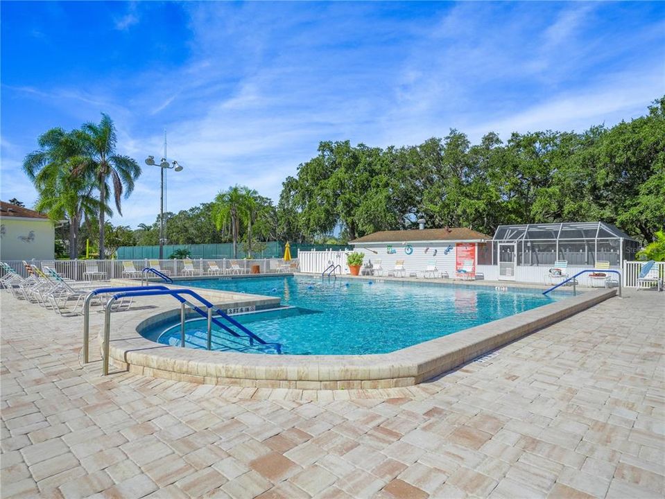 Pool with screened in Jacuzzi hot tub