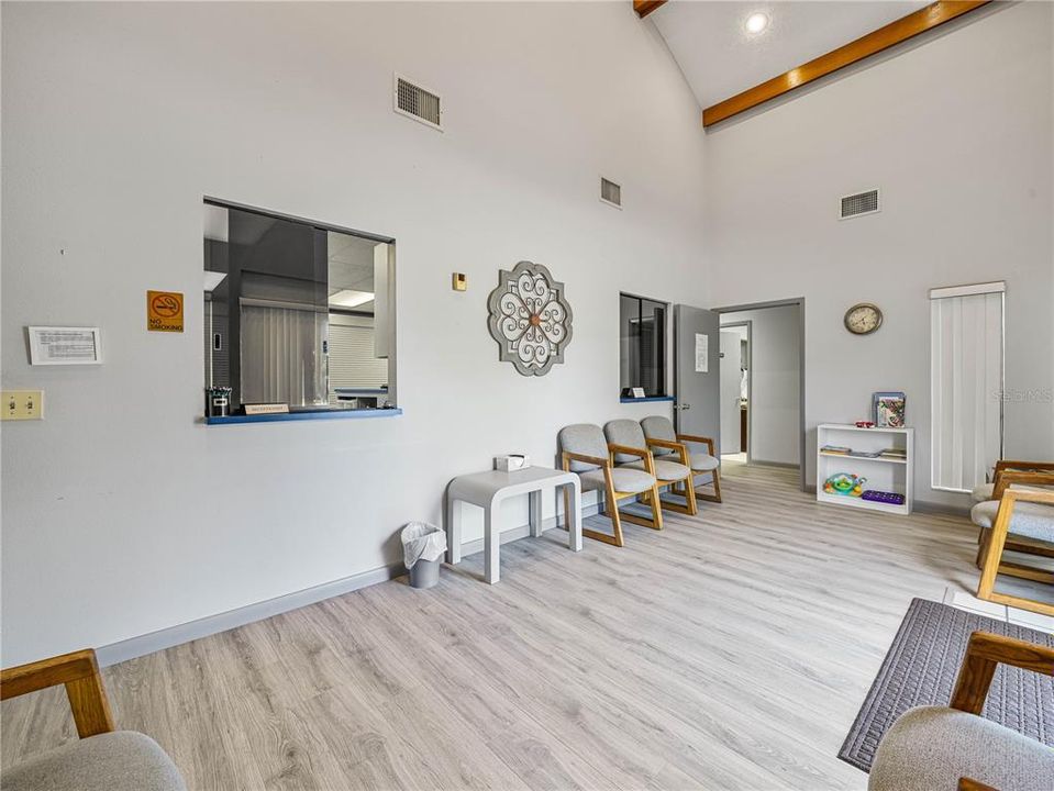 Reception area welcomes clients with soaring ceilings