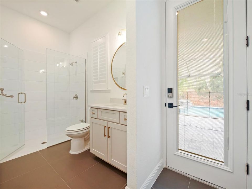 Bathroom off kitchen with pool access