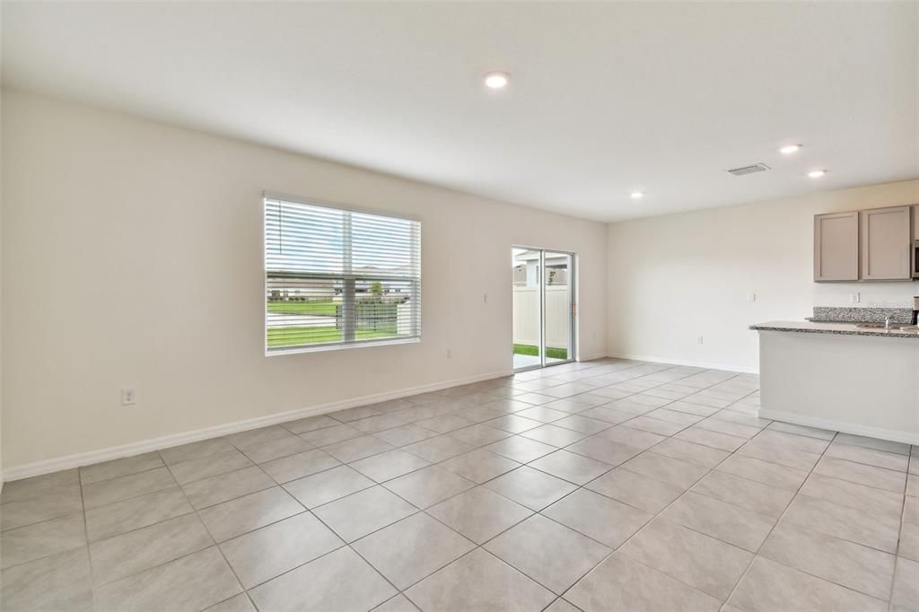 Sliders to the back patio off kitchen/family room.