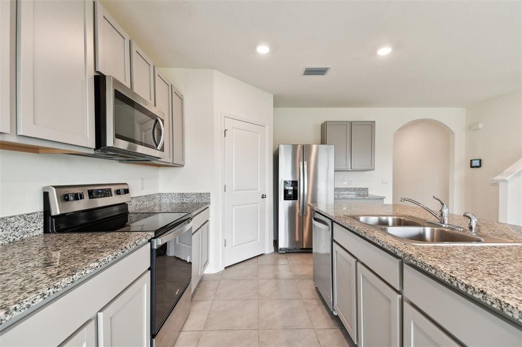 Kitchen featuring Whirlpool stainless steel appliance package.