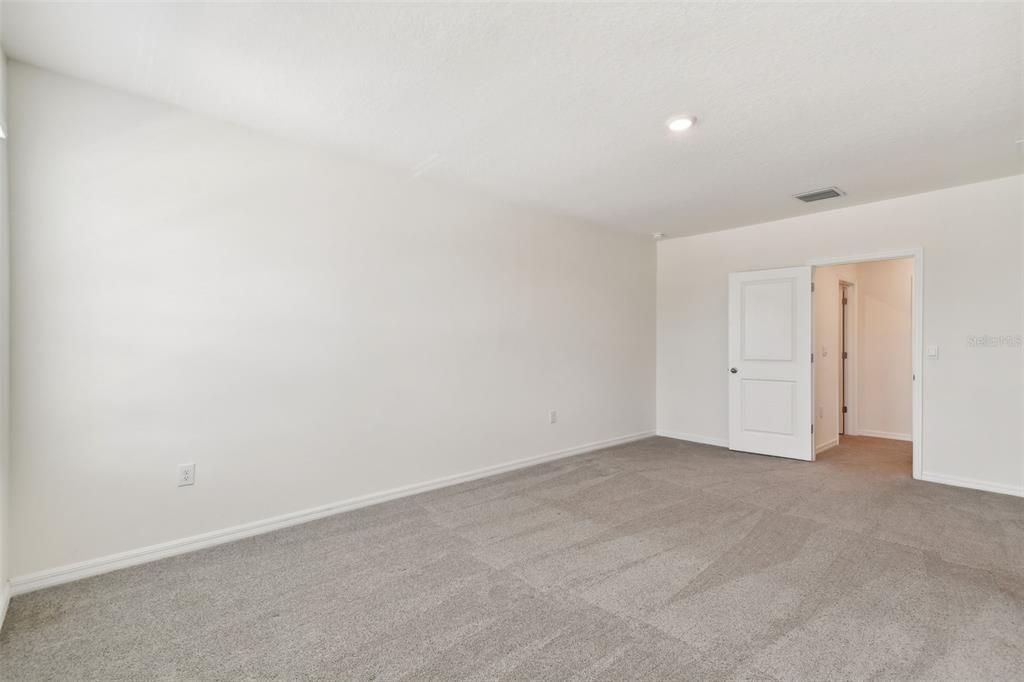 Primary bedroom with 2 walk-in closets.