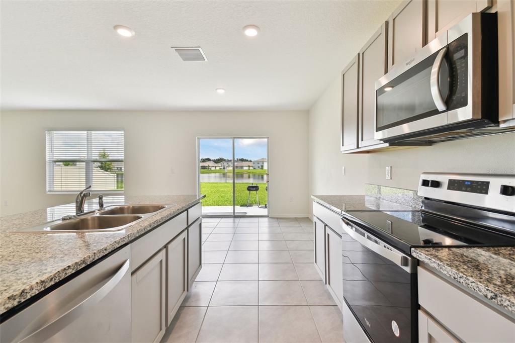 kitchen view of retention pond on the exterior of the property.