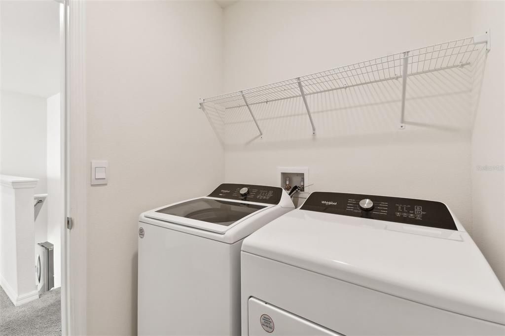 Laundry room conveniently located upstairs.