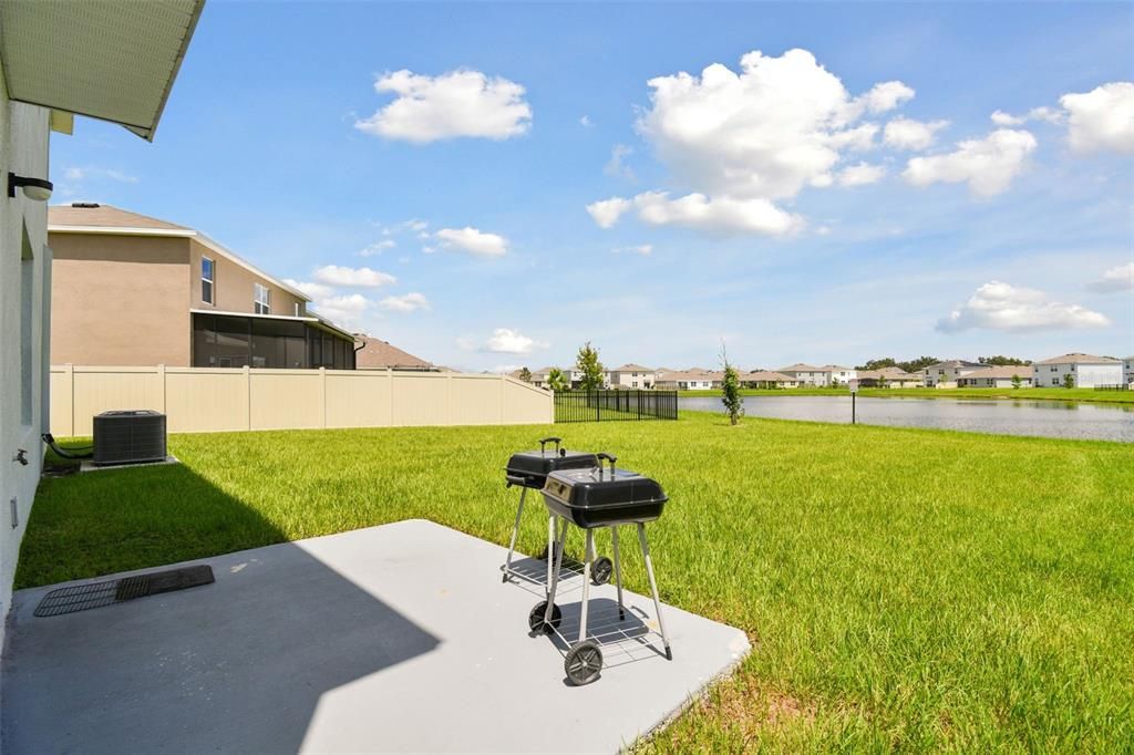 Covered patio with a view of the retention pond.