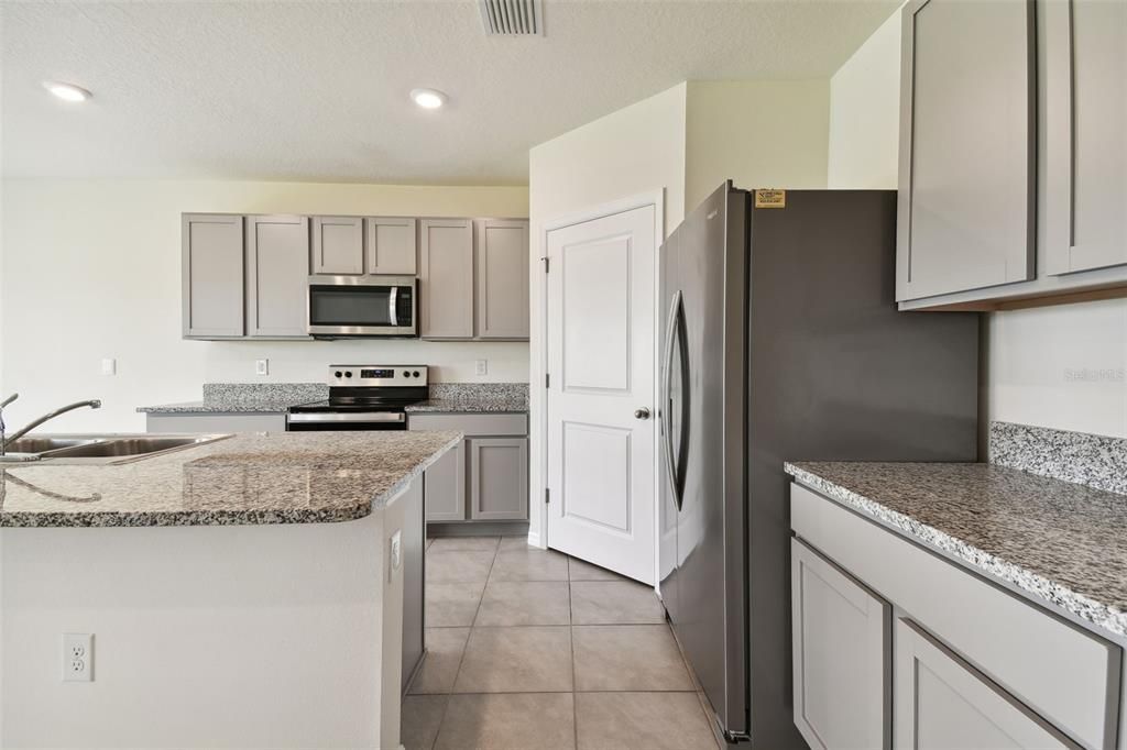 Kitchen featuring plenty of storage, and walk-in pantry.