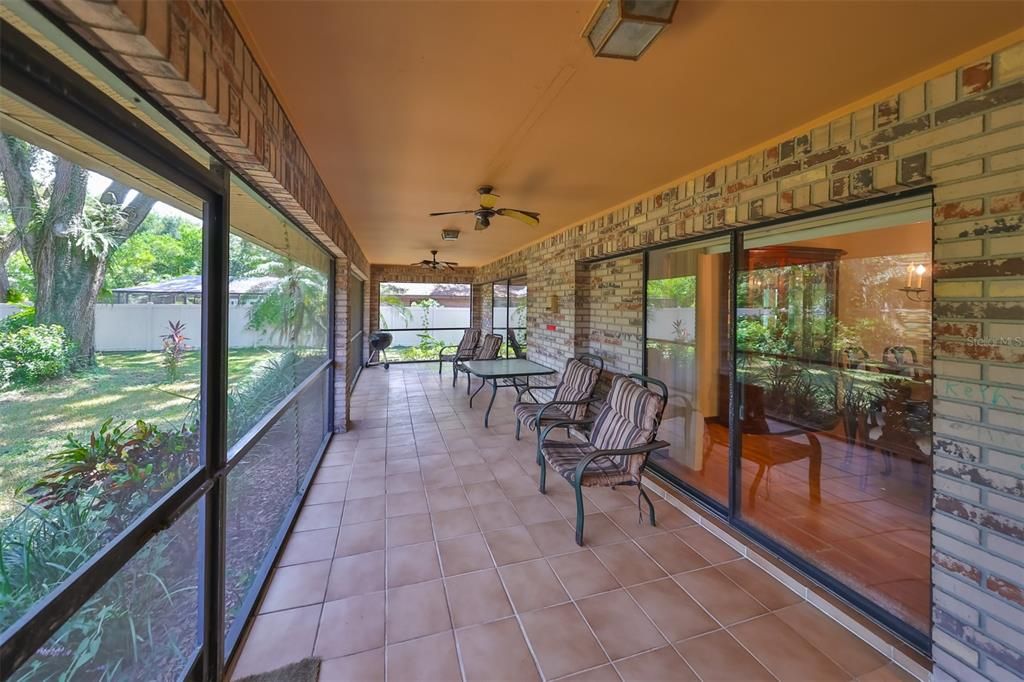 Patio is HUGE with ceiling fans and a view of the vast backyard.