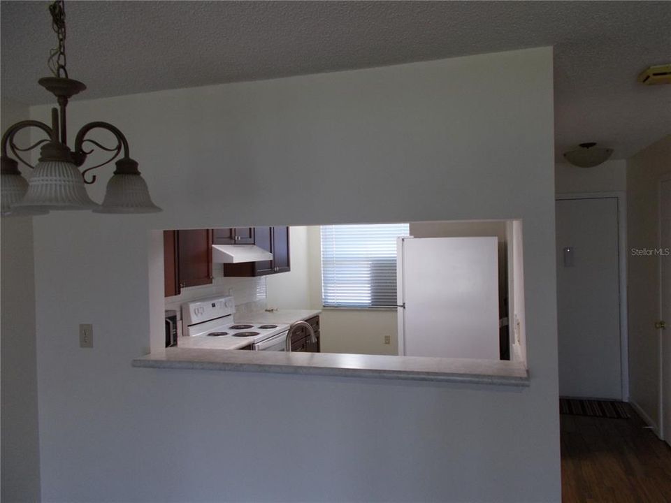 The window separating the kitchen and the dining area.