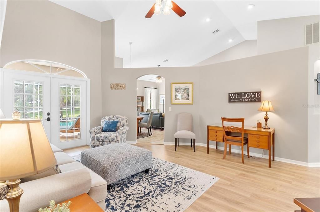 Living Area with Double French Doors that lead to Lanai Area