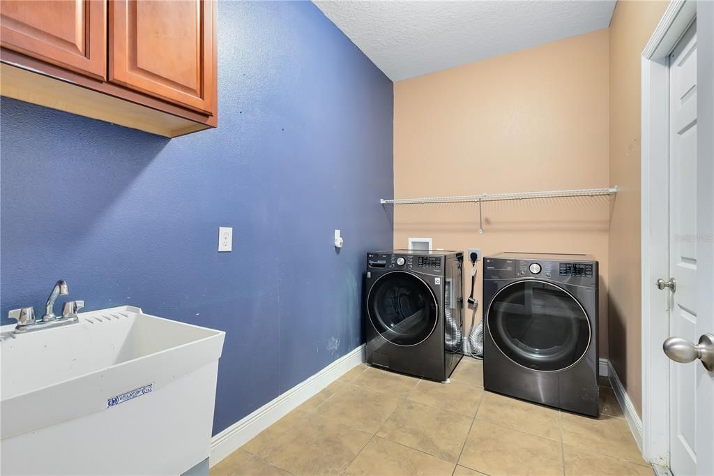 Laundry Room leading to Tandem 3 Car Garage