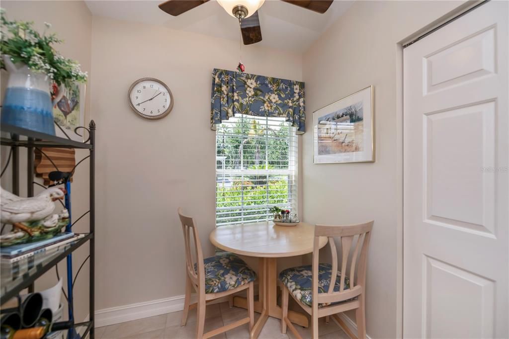 Nook area and wall pantry with wood shelving upgrade.