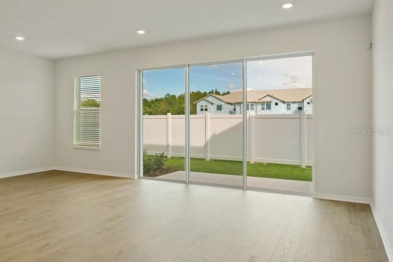 Family & Dining Room **Photos are of a Similar Home