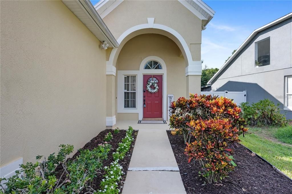 Attractive Front Entrance, with arched covered porch