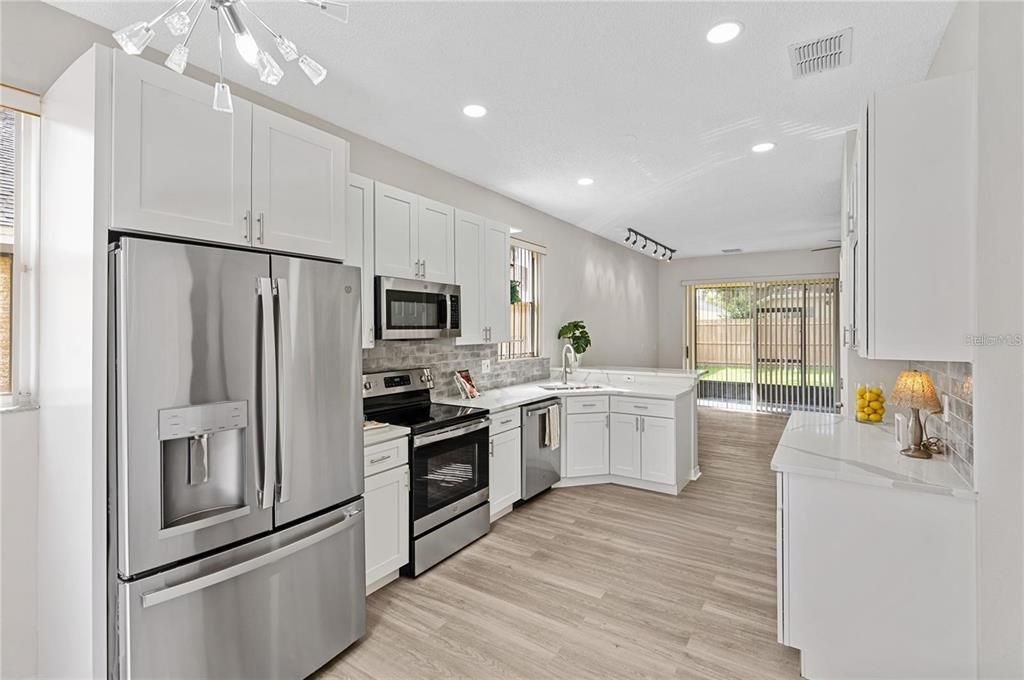 New kitchen, S/S appliances, quartz countertops, new 42" cabinets, luxury vinyl floors, easy flow