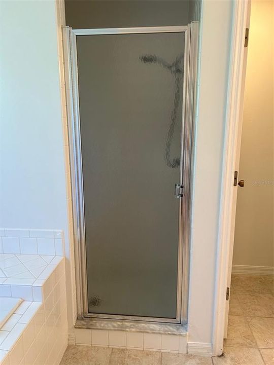 Primary walk-in shower with bench