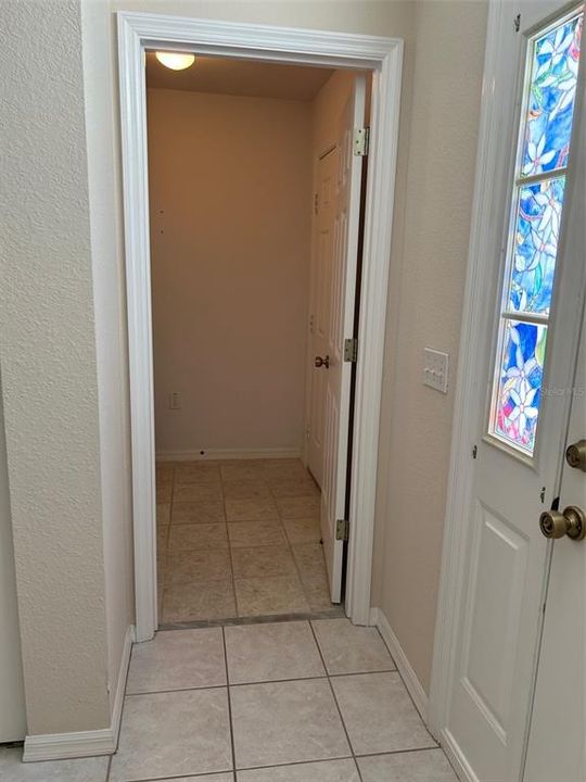 Entry to laundry room from front door & garage