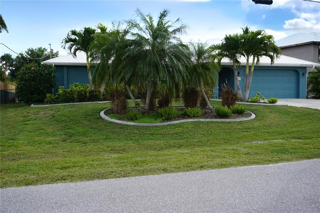 Lush tropical landscaping all around home