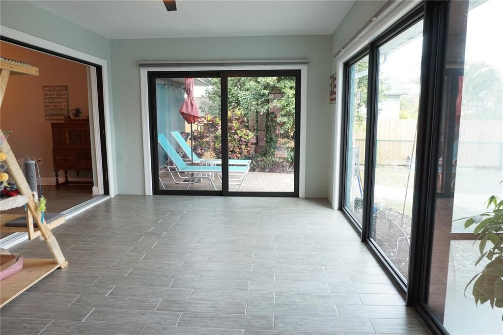 Florida room with Hunter Douglas blinds if you want more privacy or shade.