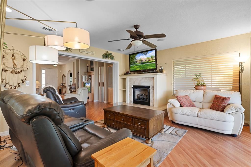 Another view of the family room that features an open floor plan.