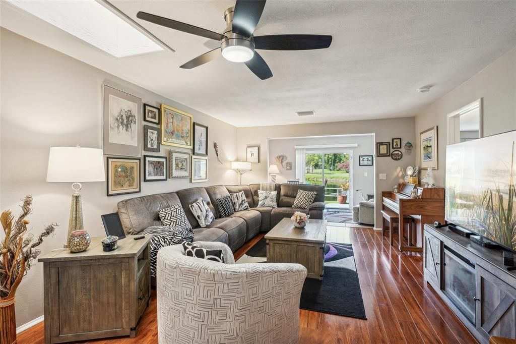 View of living space shows gorgeous flooring.