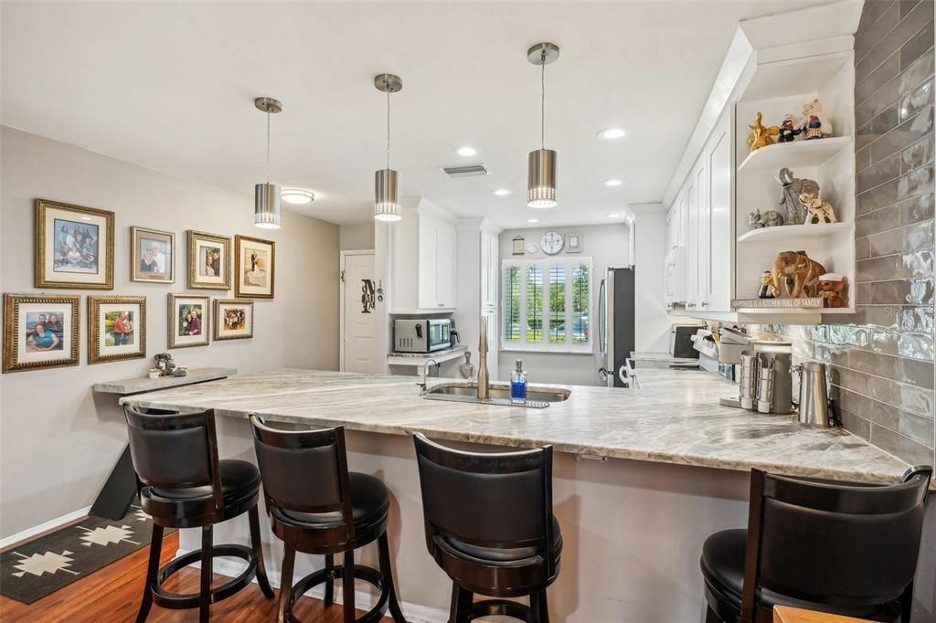 Granite counter top large enough to seat four.