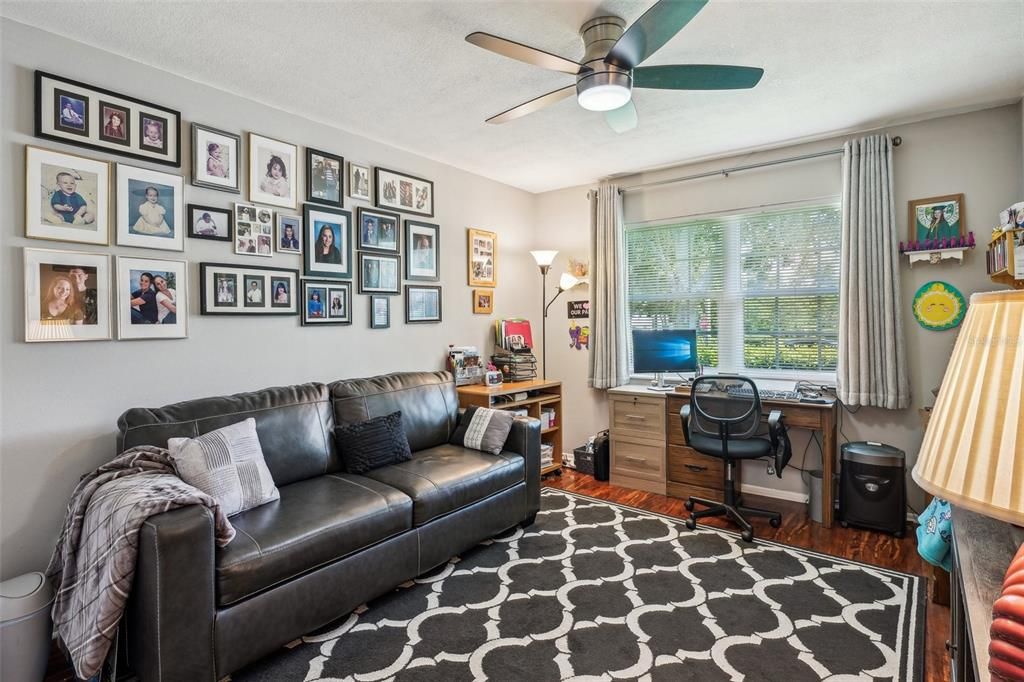 Guest bedroom with view of front yard.