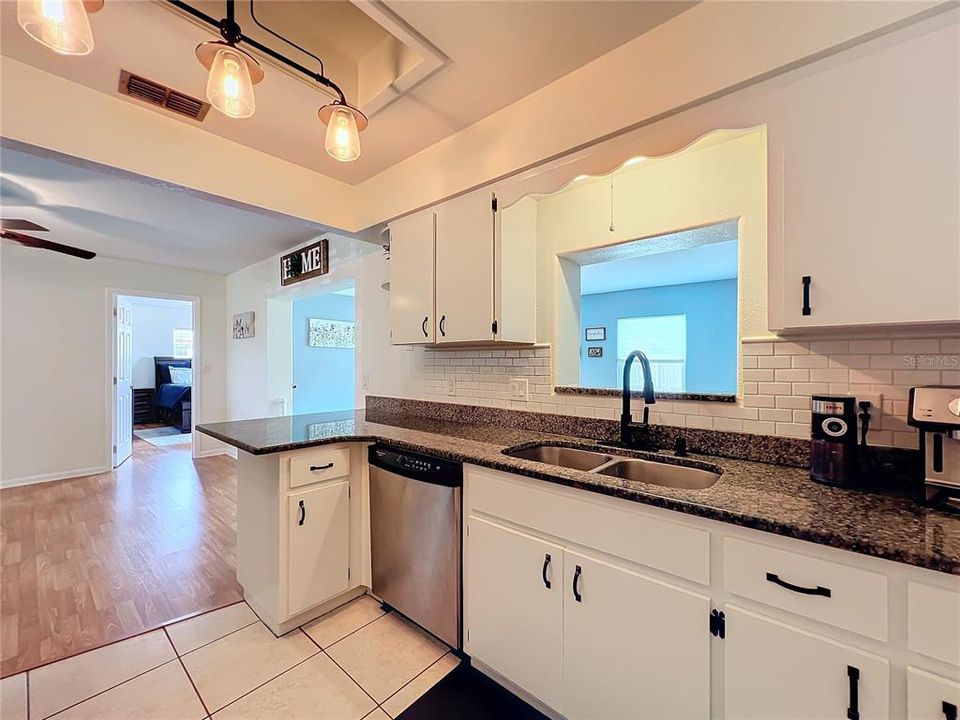 Kitchen with double sink and granite countertops