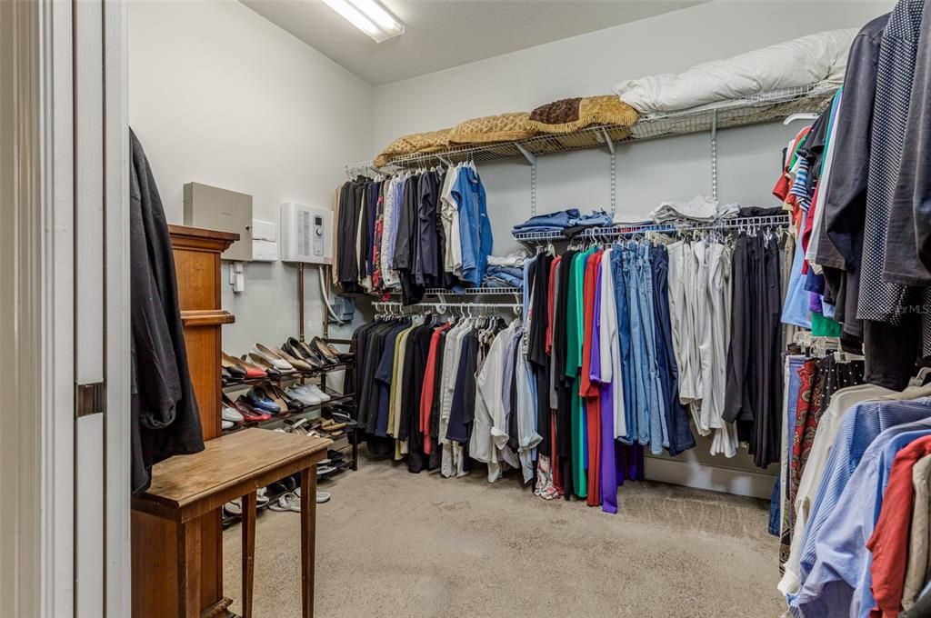 Walk in closet in primary bedroom suite