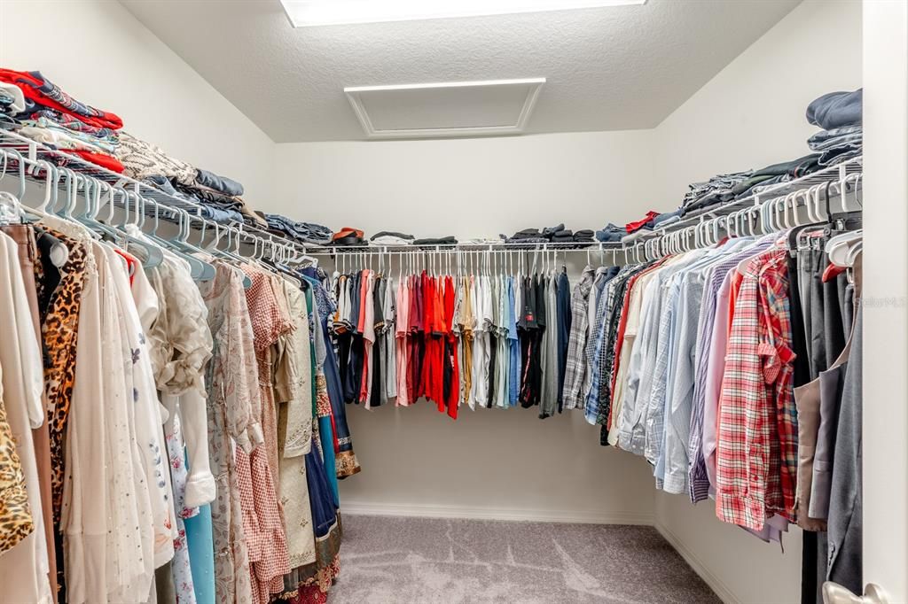 WALK IN CLOSET IN MASTER SUITE RIGHT BEFORE GORGEOUS MASTER BATH