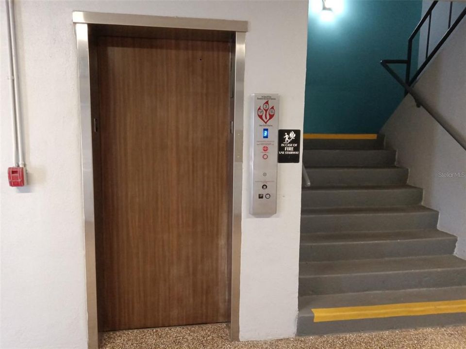 Elevator and stairs in breezeway