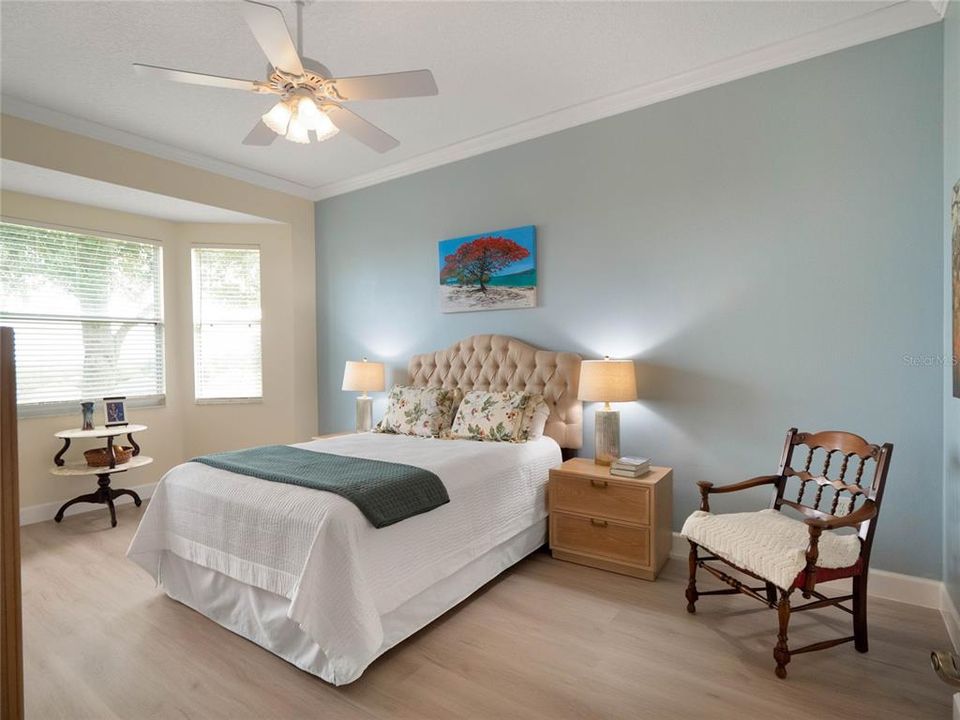 Primary bedroom with bay window.