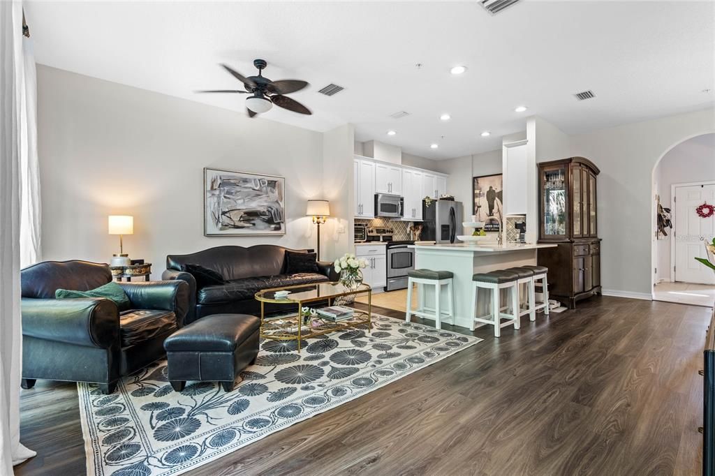 Great room with luxury plank vinyl flooring is open to the kitchen making it a great floor plan for entertaining