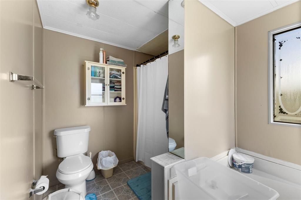 Primary Bathroom Featuring Tub and Shower