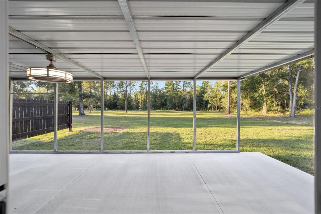 Large 360 foot covered lanai with metal roof.