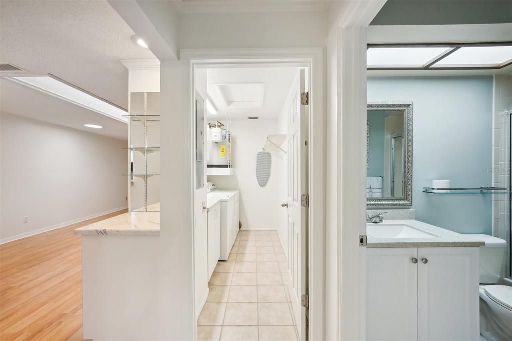 Interior laundry room next to guest bathroom